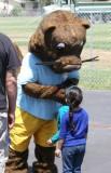 The FIRST 5 mascot with a young event attendees.